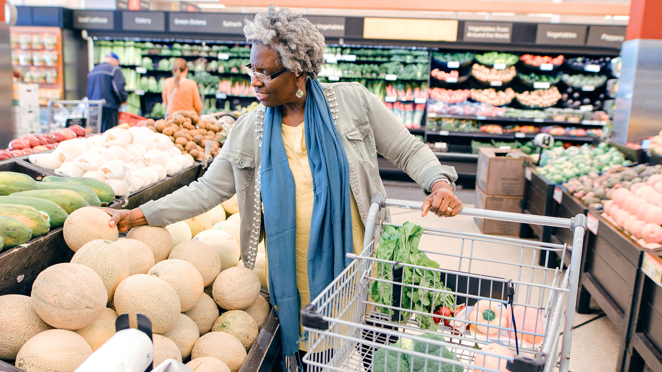  Senior woman shopping for groceries.