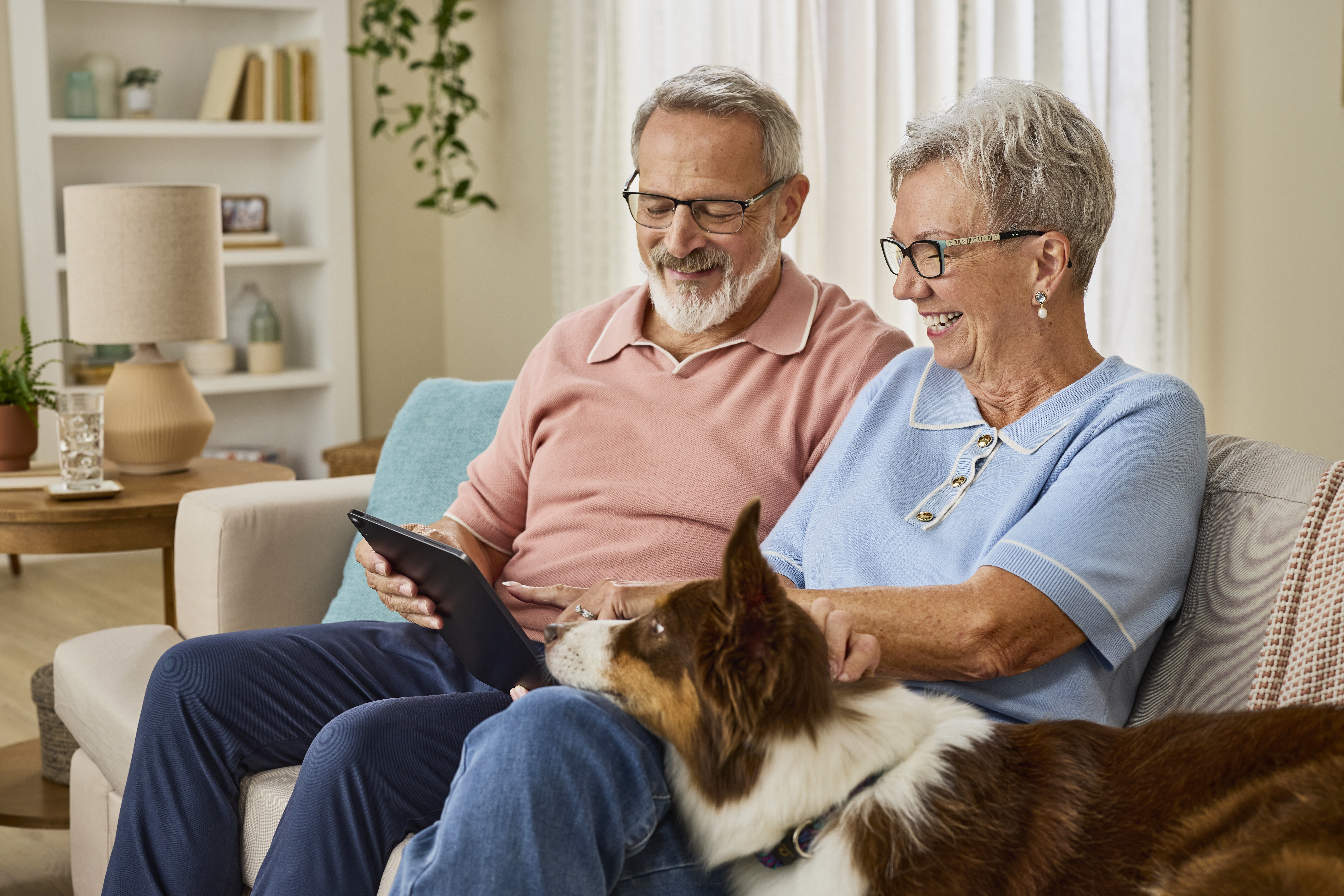 Elderly couple looking at a letter