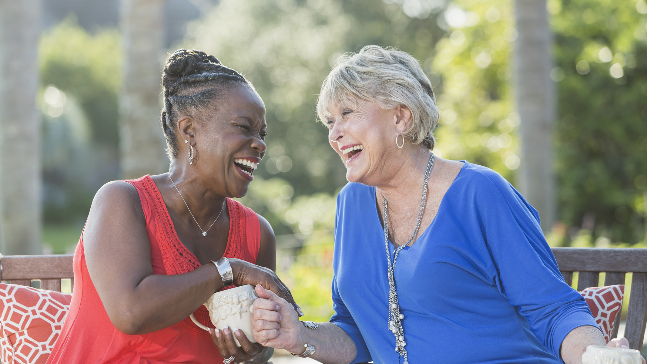 Two senior women laughing
