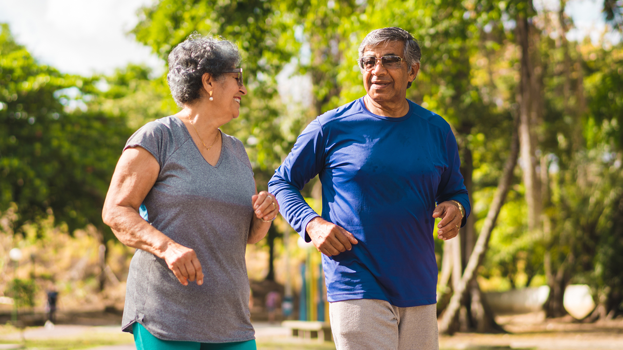 Senior couple jogging outside