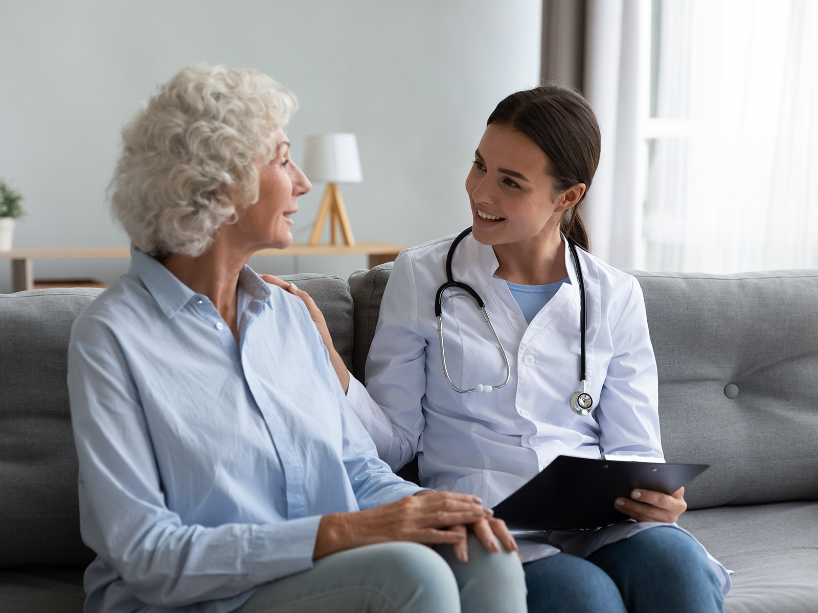 Senior woman speaking with doctor.