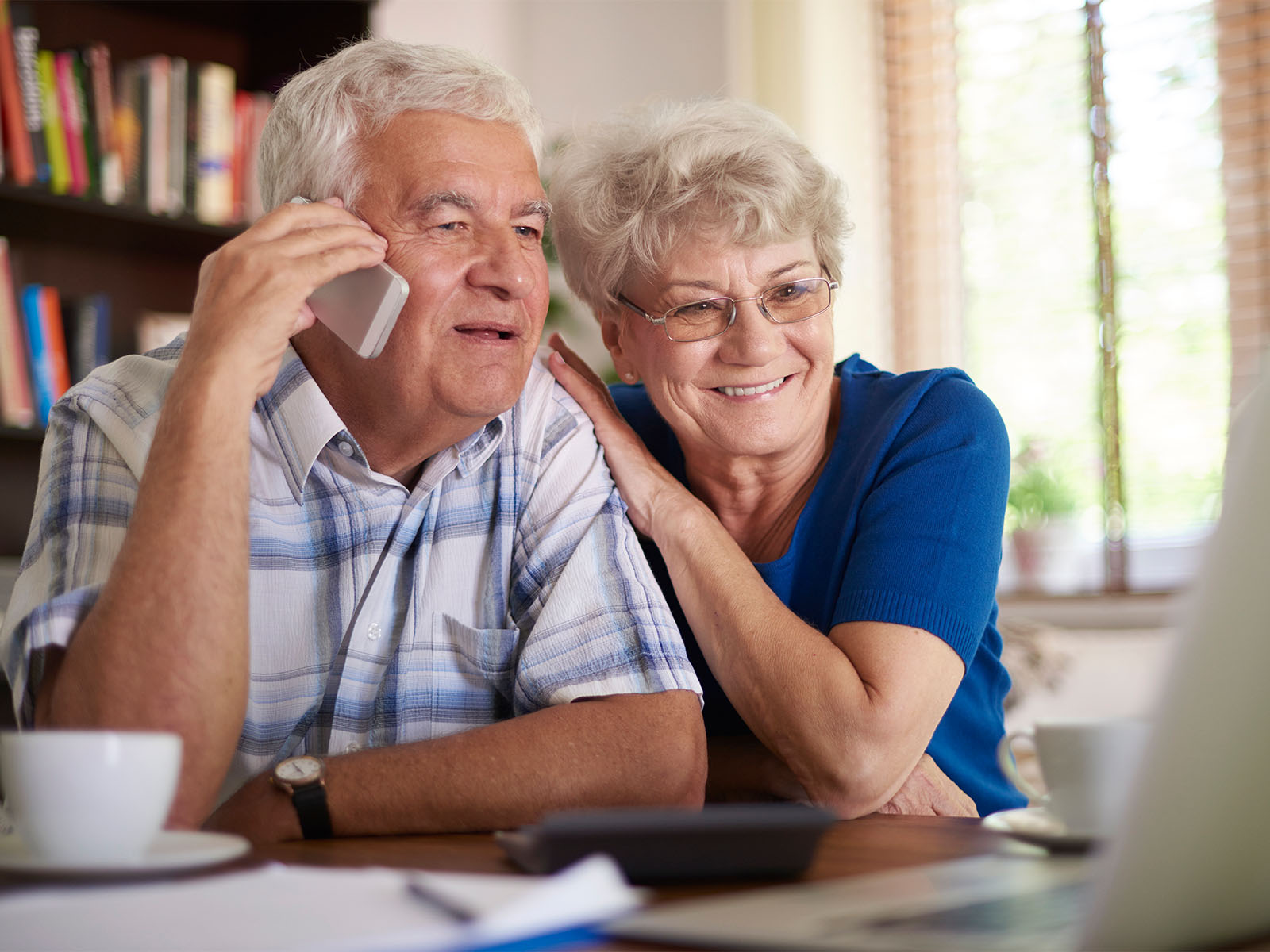 Senior couple on the phone.