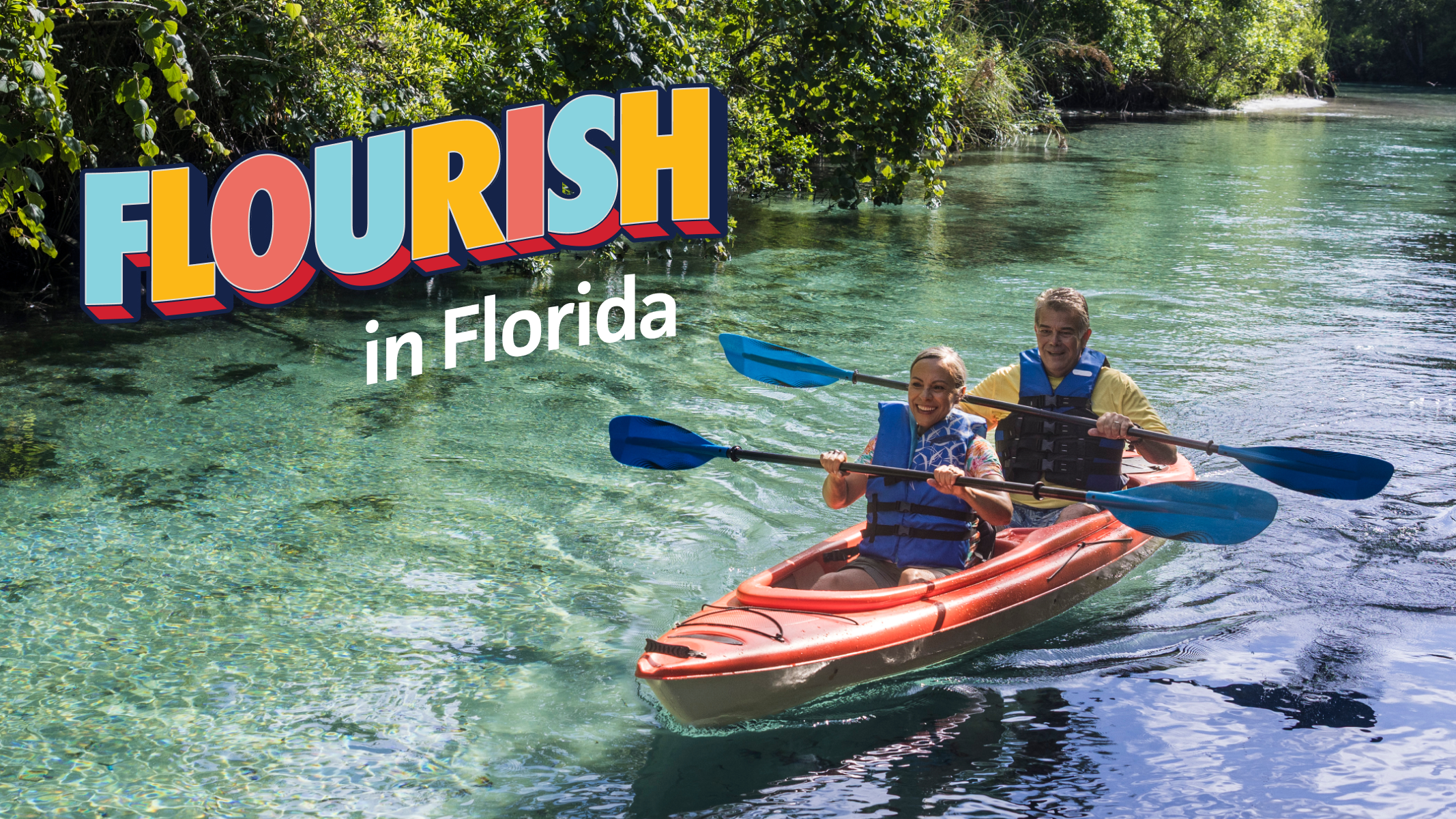 Senior woman and senior man kayaking on a clear Florida spring